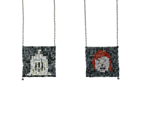 Image of a jewellery work in stainless steel, vitreous enamel and titanium. Photograph by Melissa Cameron.