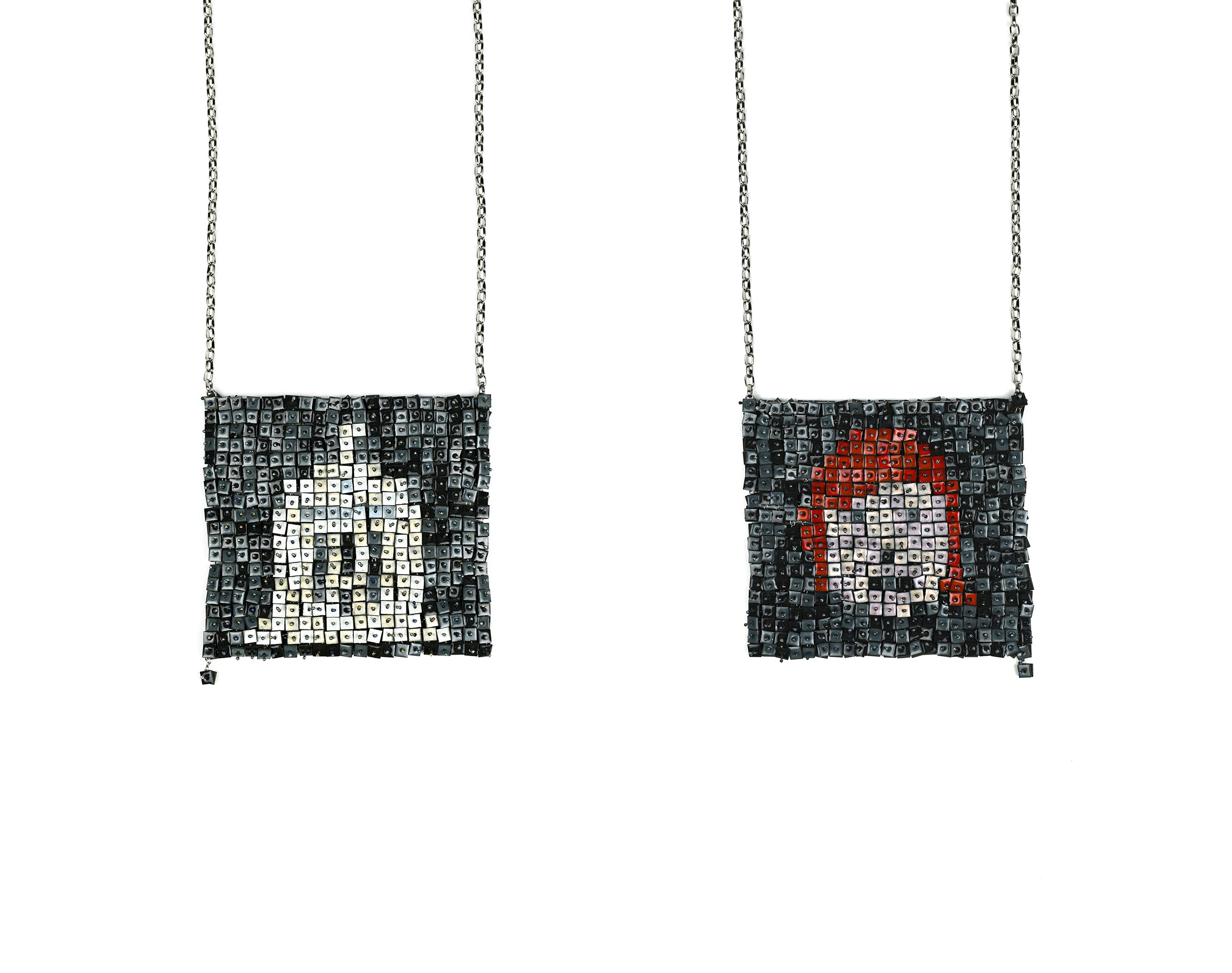 Image of a jewellery work in stainless steel, vitreous enamel and titanium. Photograph by Melissa Cameron.