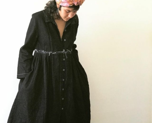 Model wearing Bukeshla classic, heavy denim dress